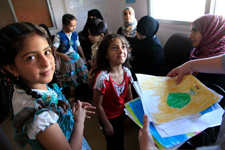 Refugee_children_from_Syria_at_a_clinic_in_Ramtha,_northern_Jordan_(9613477263).jpg