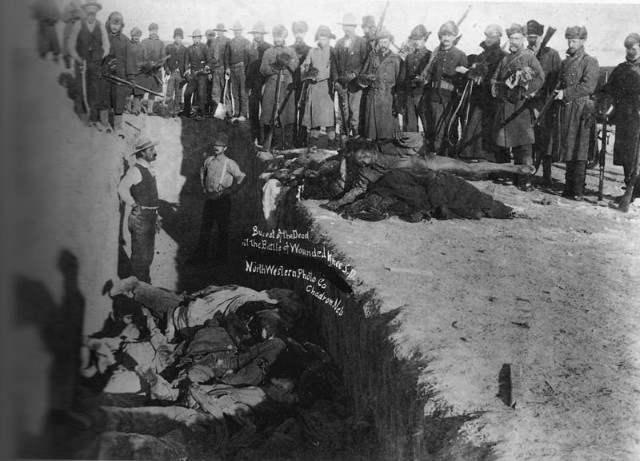 Mass grave for the dead Lakota following the 1890 Wounded Knee Massacre, which took place during the Indian Wars in the 19th century.jpg